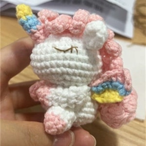 Handmade crochet woven unicorn doll keychain pendant.