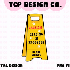 May include: A yellow caution sign with black borders and white flowers. The sign reads "Caution: Healing in Progress. Do Not Disrupt."