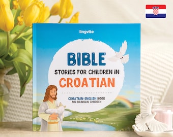 Może przedstawiać: Niebieska książka z tytułem "BIBLE STORIES FOR CHILDREN IN CROATIAN" i podtytułem "CROATIAN-ENGLISH BOOK FOR BILINGUAL CHILDREN". Okładka książki przedstawia kreskówkową ilustrację Jezusa trzymającego jagnię.