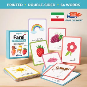 May include: A set of Farsi first words flashcards with colorful illustrations. The cards feature images of a rainbow, grapes, a strawberry, a flower, a cow, and a sun. The box of cards is blue and has the text "Farsi First Words Flashcards".