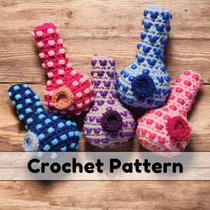 May include: Crochet pattern for a set of five colorful crocheted pipes. The pipes are made with different colored yarn and have a unique design. The pattern is available for purchase.