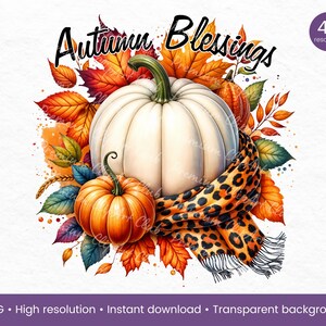 May include: A white pumpkin with a brown stem sits on a bed of colorful fall leaves. A leopard print scarf is draped over the pumpkin. The text "Autumn Blessings" is written in black above the pumpkin.