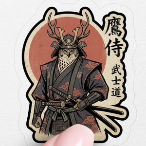 May include: A sticker featuring a samurai owl illustration. The owl is depicted in traditional samurai attire, including armor and swords, with a red circle in the background. Japanese text is also included.