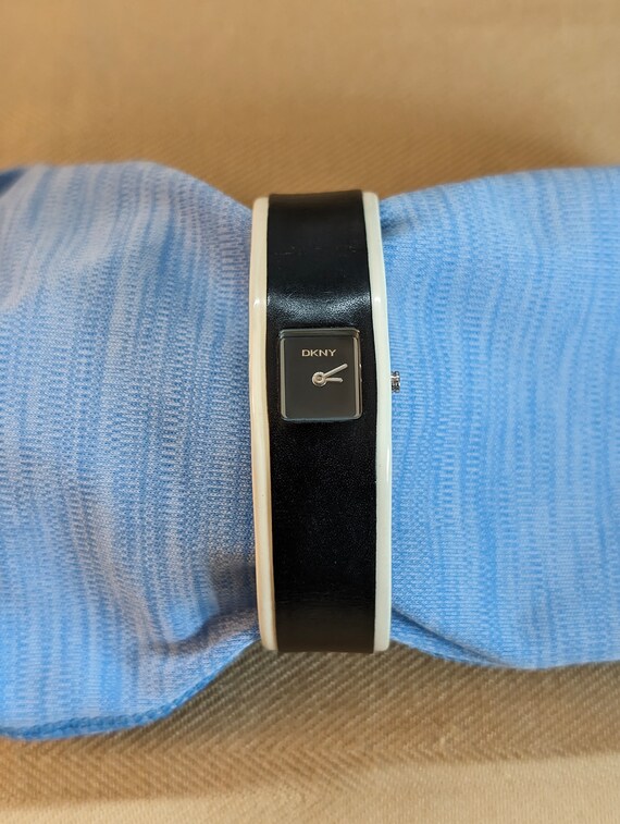 Women's DKNY Watch with black and white leather band; Great Condition, no scratches, works well