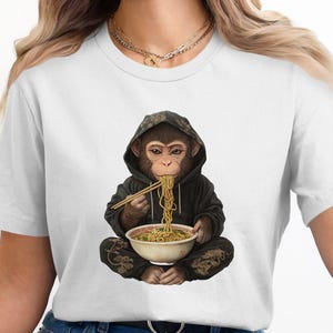 麺を食べる猿のグラフィックTシャツ：トレンディな動物デザイン