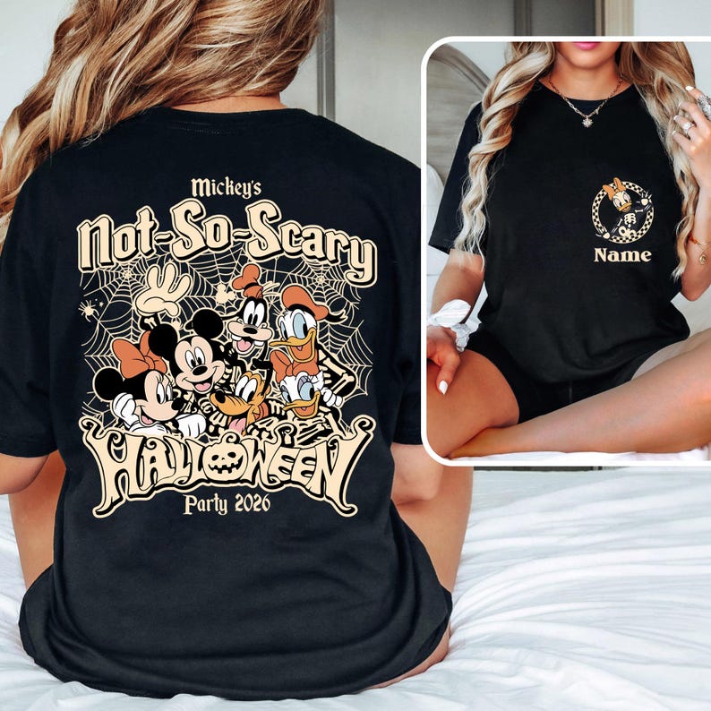 May include: Black t-shirt featuring a Halloween design with Mickey Mouse, Minnie Mouse, Donald Duck, Goofy, and Pluto. The shirt has the text "Mickey's Not-So-Scary Halloween Party 2020". A smaller design with a name is on the front.