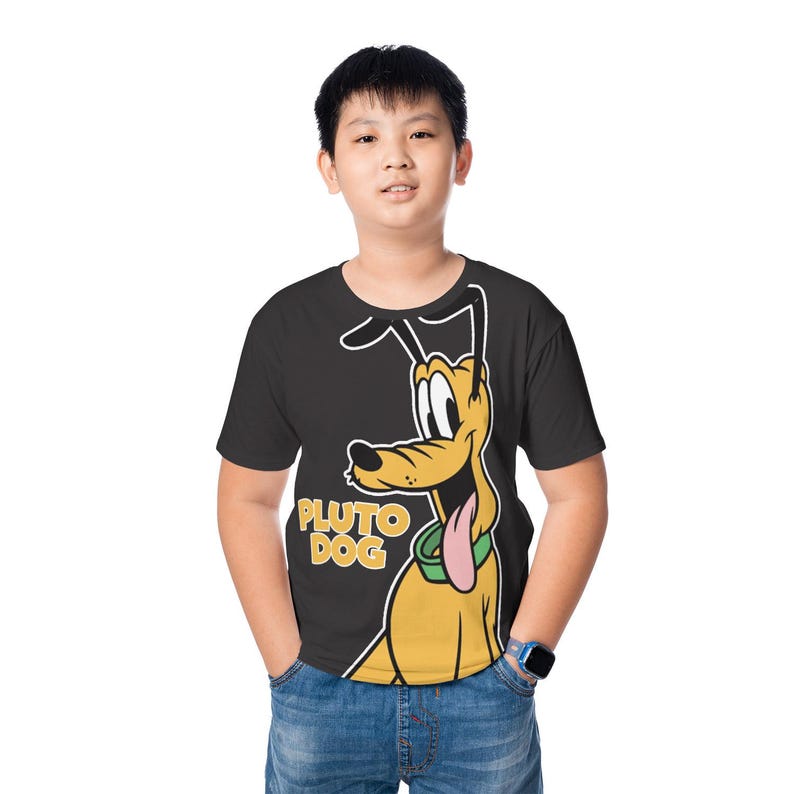 May include: A black t-shirt featuring a cartoon image of Pluto the Dog. The yellow Pluto character has a pink tongue and a green collar. The words "PLUTO DOG" are printed in yellow. The person is wearing blue jeans.