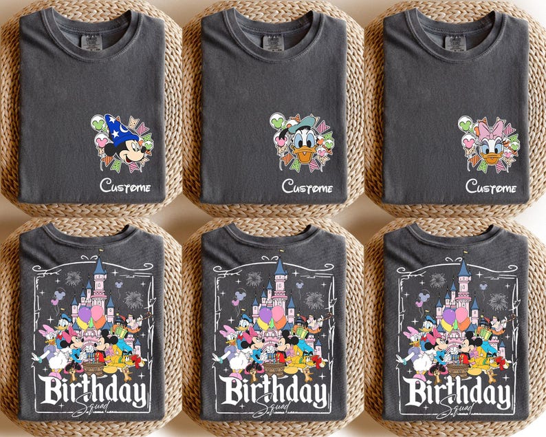 May include: Six charcoal gray t-shirts with different Disney character designs. The top row features Mickey Mouse, Donald Duck, and Daisy Duck with the word "Custome" below. The bottom row has a "Birthday Squad" design with Disney characters and a castle.