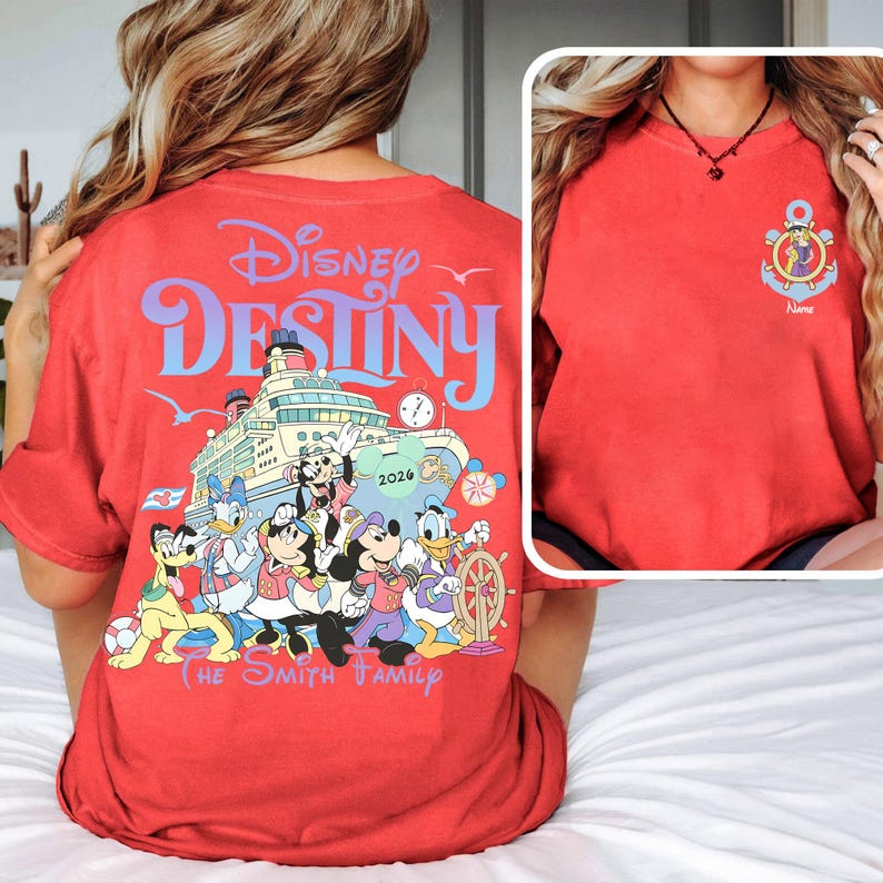 May include: Red t-shirt featuring the words "Disney Destiny" above a graphic of a cruise ship with Disney characters. The shirt also includes the text "The Smith Family" and a small anchor design with a character's image.