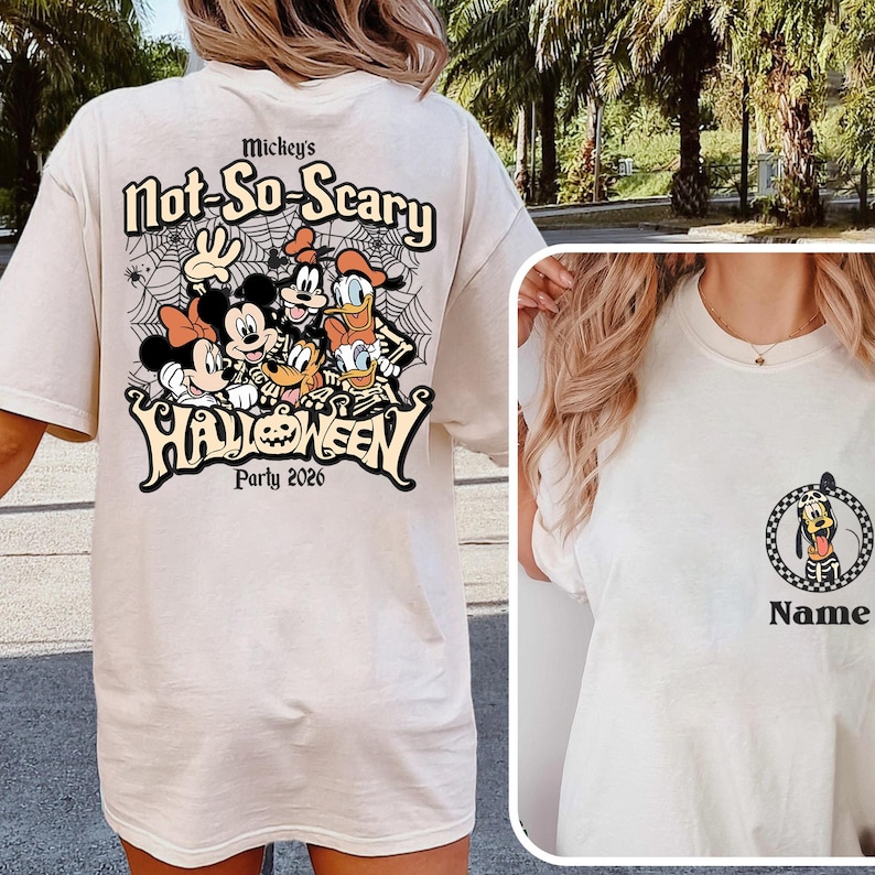 May include: Cream-colored t-shirt featuring a Halloween design. The back of the shirt displays Mickey Mouse, Minnie Mouse, Donald Duck, Goofy, and Pluto in a Halloween-themed graphic with the text "Mickey's Not-So-Scary Halloween Party 2026". The front has a Pluto graphic.