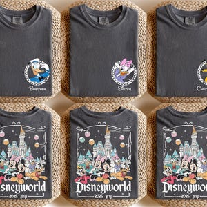 May include: Set of six gray t-shirts with Disney character graphics and text. The shirts feature Mickey Mouse, Donald Duck, Goofy, Pluto, and Minnie Mouse. The text on the shirts reads "Disneyworld - 2025 Trip -" and "Brother", "Sister", and "Custom Name".