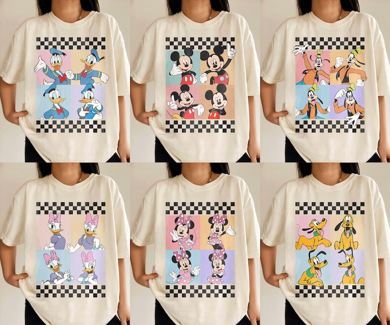 May include: Cream-colored t-shirts featuring colorful cartoon character designs. Each shirt showcases a different set of characters, including Donald Duck, Mickey Mouse, Goofy, Daisy Duck, Minnie Mouse, and Pluto, set against a checkered background.