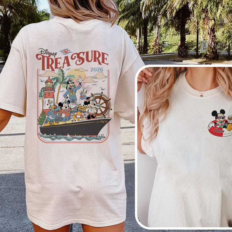 May include: Cream-coloured t-shirt with a Disney cruise design. The back graphic shows Mickey Mouse, Donald Duck, and Goofy on a ship with the text "Disney Treasure 2026." A smaller graphic of Mickey Mouse on a float is on the front.