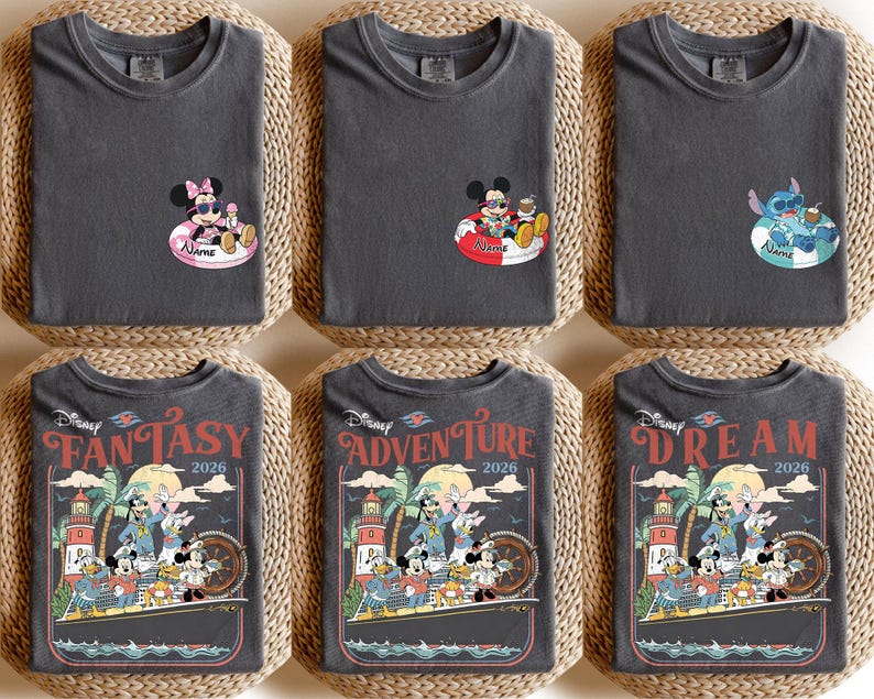 May include: Six dark grey t-shirts with Disney character graphics. Three shirts feature Mickey and Minnie Mouse or Stitch in inner tubes. The other three shirts have a vintage travel poster design with Mickey and friends, the words "FANTASY", "ADVENTURE", and "DREAM", and the year 2026.