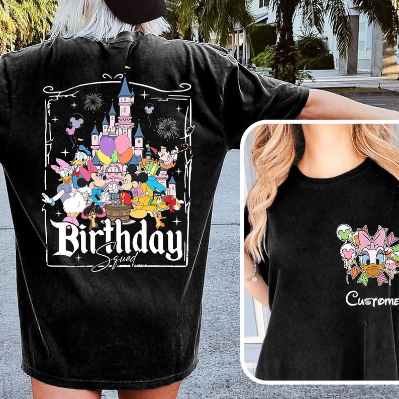 May include: Black t-shirt featuring a colorful graphic of Disney characters, a castle, and the words "Birthday Squad." The design includes Mickey and Minnie Mouse, Donald and Daisy Duck, and other characters. A smaller image of Daisy Duck is on the pocket.