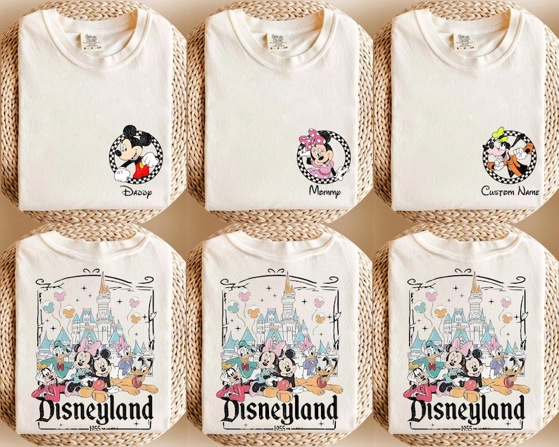 May include: Six white t-shirts with different Disney character designs. The shirts feature Mickey Mouse, Minnie Mouse, and Goofy. The shirts also have the text "Daddy", "Mommy", "Custom Name", and "Disneyland" printed on them.