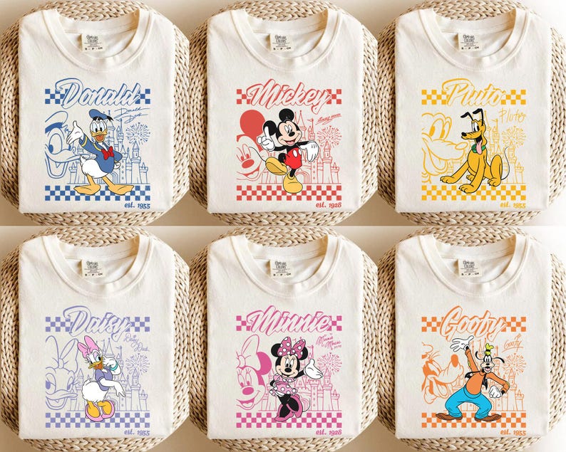 May include: Six off-white t-shirts featuring Disney characters: Donald Duck, Mickey Mouse, Pluto, Daisy Duck, Minnie Mouse, and Goofy. Each shirt has a character graphic, name, and "est. 1955" text. The designs are set against a checkered background.