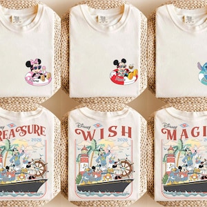May include: Cream-coloured t-shirts featuring Disney characters. Designs include Minnie Mouse, Mickey Mouse, and Stitch in inflatable rings, and cruise ship scenes with Mickey and friends. The shirts are folded on woven mats.