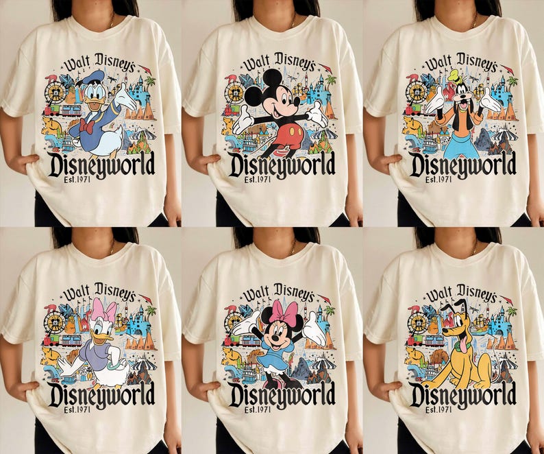 May include: Cream-colored t-shirts featuring various Disney characters like Mickey Mouse, Donald Duck, and Goofy. Each shirt has a colorful graphic of Disney World with the text "Walt Disney's Disneyworld Est. 1971."