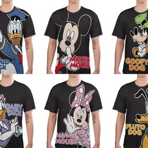 May include: Six black t-shirts featuring Disney characters: Donald Duck, Mickey Mouse, Goofy, Daisy Duck, Minnie Mouse, and Pluto. Each shirt displays a large graphic of the character with their name below. The shirts are short-sleeved.