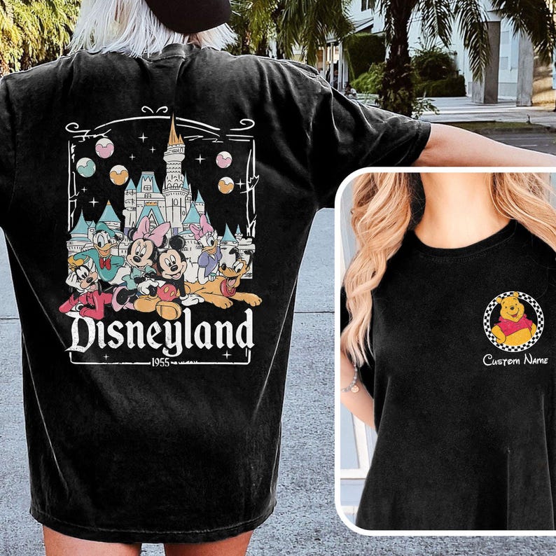 May include: Black t-shirt featuring a Disneyland graphic on the back with Mickey Mouse, Minnie Mouse, Donald Duck, and other characters. The front has a small Winnie the Pooh design with the text "Custom Name".
