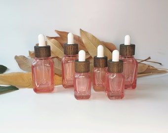 Botella cuentagotas de vidrio rojo de 15 ml y 35 ml con tapa de madera, botella de muestra recargable, adecuada para líquidos cosméticos de perfume de aceite esencial de viaje