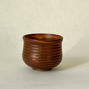 Red shino wheel thrown stoneware ceramic espresso cup.