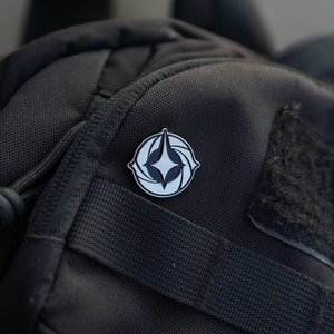 Lorcana-logopin (zwart en zilver)