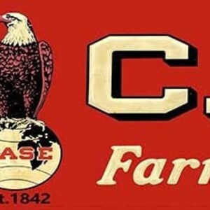 May include: A vintage logo for Case Farm Machinery. The logo features a bald eagle perched on a globe with the words "CASE" in large white letters and "Farm Machinery" in smaller white letters below.