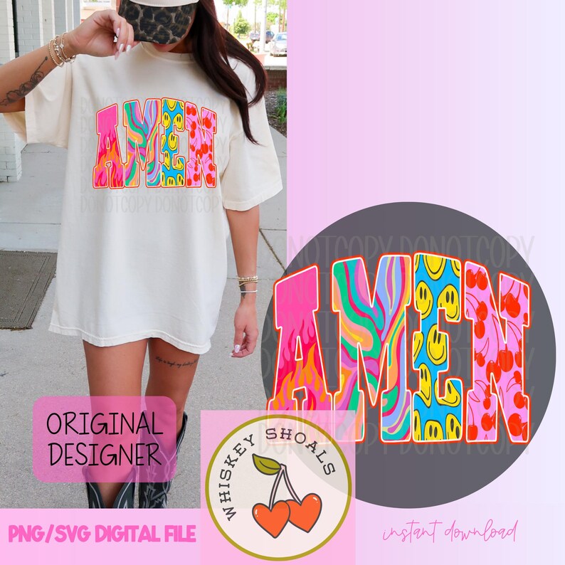 Puede incluir: Camiseta color crema con la palabra "AMEN" en un dise&ntilde;o psicod&eacute;lico colorido. Las letras presentan remolinos, llamas, caras sonrientes y cerezas. Tambi&eacute;n es visible un logotipo redondo con cerezas y el texto "Whiskey Shoals".
