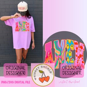 Puede incluir: Una camiseta de color lila claro con la palabra "AMEN" en un dise&ntilde;o retro colorido. El dise&ntilde;o incorpora llamas, caras sonrientes y cerezas. La imagen tambi&eacute;n incluye un sombrero con el texto "I LOVE YOU" y un logo con cerezas.