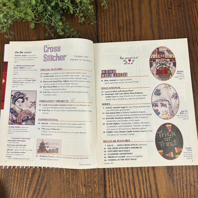 May include: Open magazine spread featuring cross-stitch patterns and articles. The cover reads "Cross Stitcher" October 1997. Includes images of finished cross-stitch projects, such as a Geisha Bride and a "Trick or Treat" design.