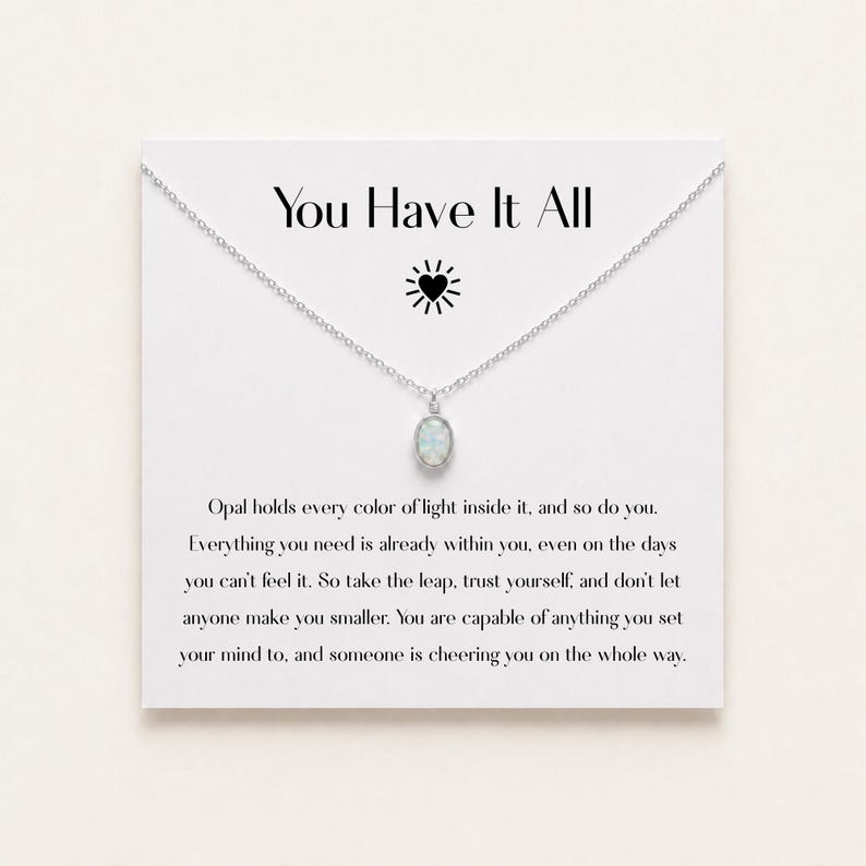 May include: A silver-toned necklace with an oval opal pendant displayed on a white card featuring the text You Have It All, a heart icon, and an inspirational message about inner strength and self-belief printed in black ink.