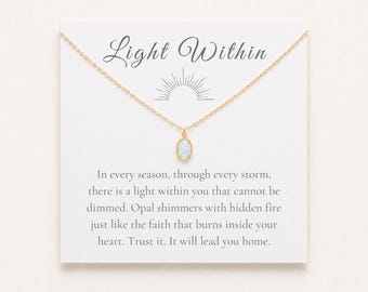 May include: A gold chain necklace with an oval opal pendant displayed on a white card. The card features the text Light Within and a sunburst graphic, followed by the message: In every season, through every storm, there is a light within you that cannot be dimmed. Opal shimmers with hidden fire just like the faith that burns inside your heart. Trust it. It will lead you home.