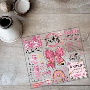 a paper with a pink bow on top of it