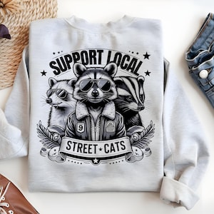 Unterstützen Sie Ihre lokale Straßenkatzen PNG | Lustiges Tier Sublimations Design | Trendiges Tshirt png | wild aber niedlich | Wildtiere png | Lustiger Waschbär