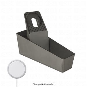 May include: A dark grey charging stand featuring an angled mount with a circular cutout and diagonal textured lines, labelled with the text MagSafe 25W. Below the stand is a separate white circular wireless charger and the text Charger Not Included.