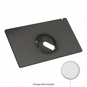 May include: A rectangular dark grey charging stand featuring a central circular cutout with the text MagSafe 25W embossed on the inner rim. A small notch is visible on the top edge. A separate white circular wireless charger is shown below.