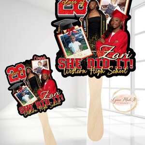 May include: Two graduation fan decorations. The fans feature a black background with red and gold accents. Each fan has photos, the text "Class of 23", "She Did It!", and "Western High School". One fan has the name "Zari".