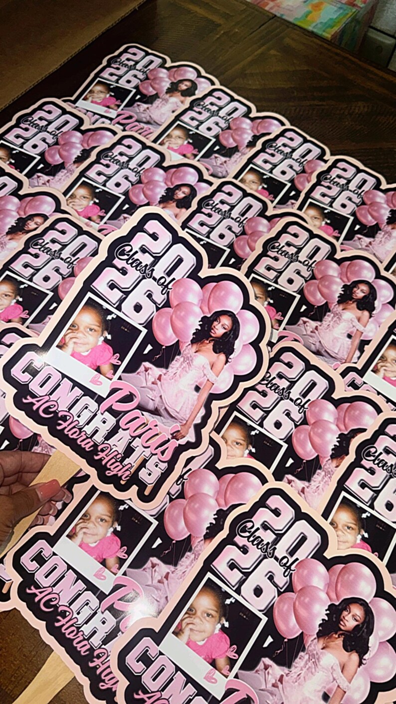 May include: A collection of pink and black graduation stickers. Each sticker features a photo of a person, the text "Class of 26", and the words "Congrats Paris AC Flora High". The stickers have a pink and black color scheme.