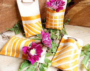 A hanging vase, hand-thrown, orange