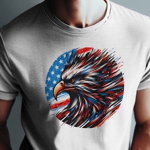 May include: White t-shirt with a graphic of a bald eagle's head in front of a red, white, and blue American flag.