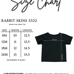 May include: Black infant fine jersey tee with a size chart. The chart lists sizes 6M to 24M, with corresponding width and length measurements in inches. Care instructions are also included. The text "Size Chart" is at the top.