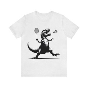 Unique Dinosaur Graphic T-shirt, T-Rex Playing Badminton Shirt, Quirky Animal Sports Tee, Retro Style Prehistoric Dinosaur Lover Top