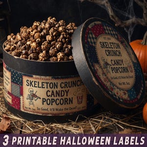 May include: A round black container filled with dark brown candy popcorn. The label features a skeleton playing a violin, a popcorn bucket icon, and the text: Skeleton Crunch Candy Popcorn, So Good, It'll Wake the Dead!, Net Wt. 142g, Est. 1904.