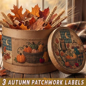 May include: A round cardboard box decorated with autumn patchwork labels featuring pumpkins, an owl, and a scarecrow. The box is filled with dried maple leaves and wheat stalks. The lid, also decorated with seasonal motifs, rests beside the box.