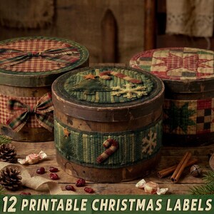 May include: Three round wooden boxes with lids, decorated with fabric patches featuring Christmas motifs like candy canes, snowflakes, and stars. The boxes have a weathered finish and are adorned with plaid ribbons and fabric trim.