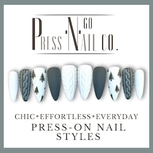 May include: A collection of press-on nails in various designs. The nails feature matte gray, white cable knit, and white nails with small Christmas tree designs. The text "PRESS N GO NAIL CO." is at the top, with "CHIC • EFFORTLESS • EVERYDAY PRESS-ON NAIL STYLES" below.