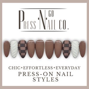 May include: A set of press-on nails in various designs and colors. The nails feature a mix of solid brown, checkerboard, and cable knit patterns. The text "PRESS N GO NAIL CO." is displayed above the nails, with additional text below reading "CHIC • EFFORTLESS • EVERYDAY PRESS-ON NAIL STYLES."