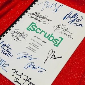 May include: A white script with the title "Scrubs: My First Day" and the show's logo in green. The script is signed by the cast members, including Zach Braff, Donald Faison, Sarah Chalke, Neil Flynn, and Ken Jenkins.